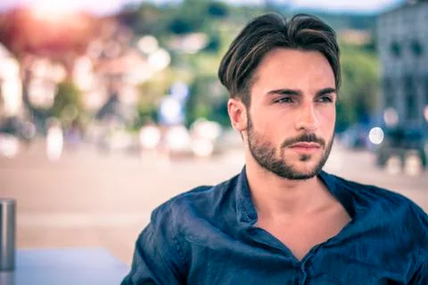 One handsome young man by river in city Stock Photos