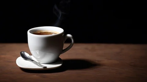 One hot coffee cup spoon wooden table dark background nobody hd footage Stock Footage 102727147