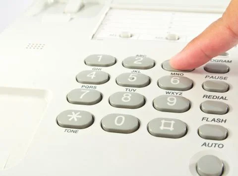 One human hand pressing key on phone Stock Photos