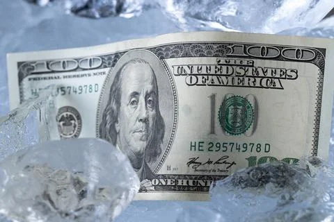 One Hundred Dollar Banknote Between Ice Blocks Stock Photos