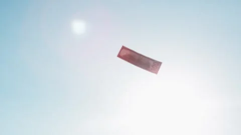 One hundred dollar bill flying in bright sky with sun glare, economic concept Stock Footage 337387761