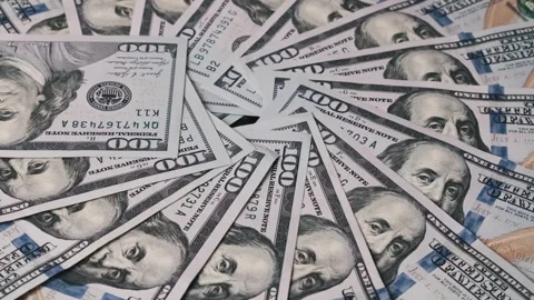 One Hundred Dollar Bills Arranged in Spiral Pattern Stock Footage 303920257