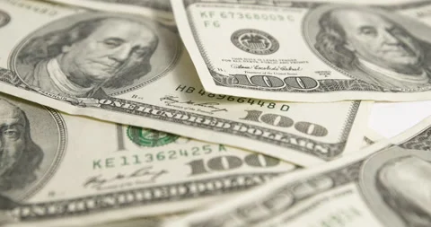 One hundred dollar bills, banknotes in motion. Close-up of money.  Stock Footage 171069134