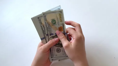 One hundred dollar bills counted, displayed and arranged on white background Stock Footage 345178941