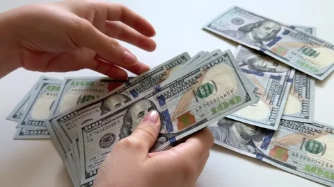 One hundred dollar bills counted, displayed and arranged on white background Stock Footage 345182594