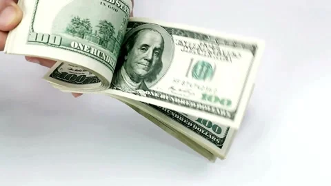 One hundred dollars banknotes pack in hands. Male hands counting dollar cash in 스톡 동영상 336262939
