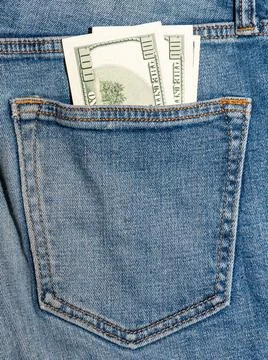 One hundred US dollars in the back pocket of jeans Stock Photos