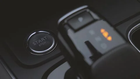 One-key start ignition button and electronic gear lever in car interior Stock Footage 156943051