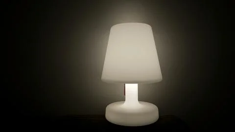 One Lamp glowing light in dark. Bedside nightlamp Stock Photos