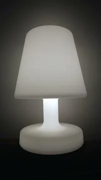 One Lamp glowing light in dark. Bedside nightlamp in Vertical Video Stock Photos