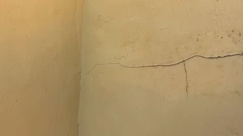 One large crack in wall showing the crack in detail with a corner, good Stock Footage 107120668