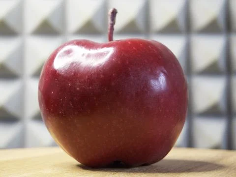 One large red apple. Apple of the Red Chief variety. Stock Photos
