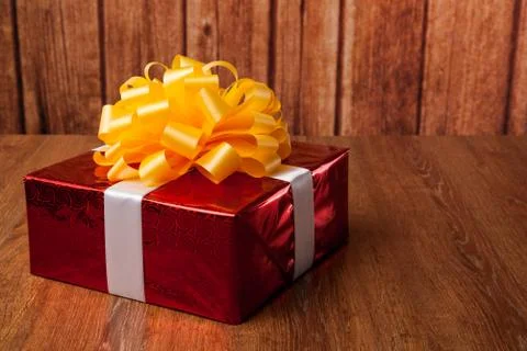 One large red gift box on a wood Foto stock