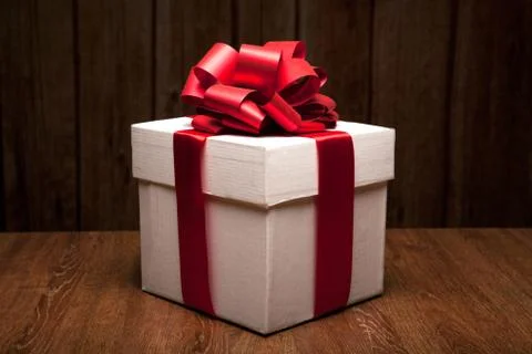 One large white gift box on a wood Foto stock