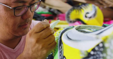 One of the last paper dragon masters of Hong Kong, painting design onto hand mad Video stock 201094293
