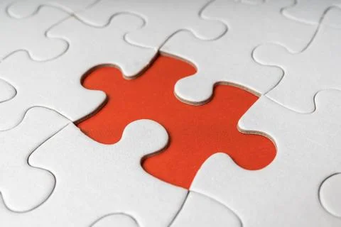 One last piece of white empty puzzle is missing. Stock-Fotos