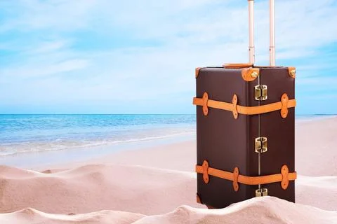 One leather suitcase on sandy beach near sea. Space for text Stock-Fotos