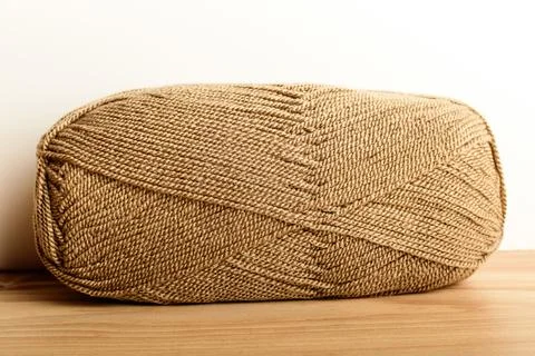 One light brown knitting wool threads for sewing or from embroidery isolated  Stock Photos