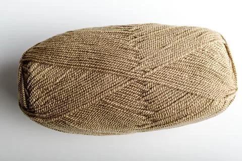 One light brown knitting wool threads for sewing or from embroidery Foto stock
