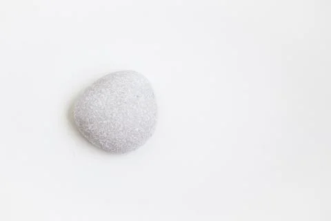 One light pebbles on the white background Stock Photos