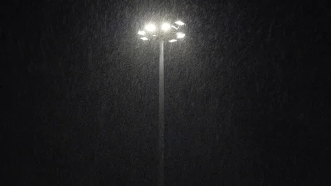 One light pole in snowstorm, severe winter weather at night hour Stock Footage 85690670