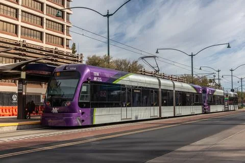 One Light Rail train at station in downtown district on Main St. Stock Photos