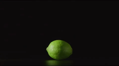 One lime lies on a table - Light is ON and OFF Stock Footage 62317131