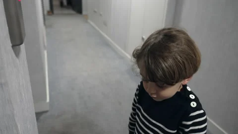 One little boy pressing elevator button standing in corridor. Child hand pres Stock Footage 219878849