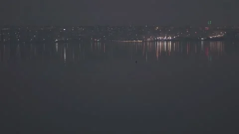 One lonely bird is floating towards the city lights Video stock 150114835