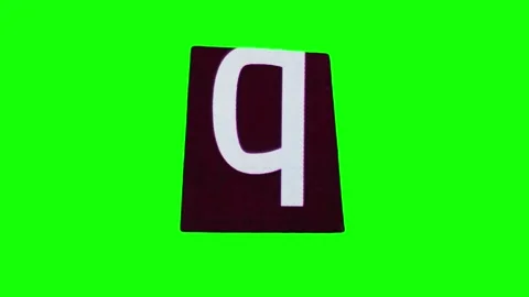 One lowercase letter q on black ripped paper crumpling and unwrapping on chroma Stock Footage 251832288