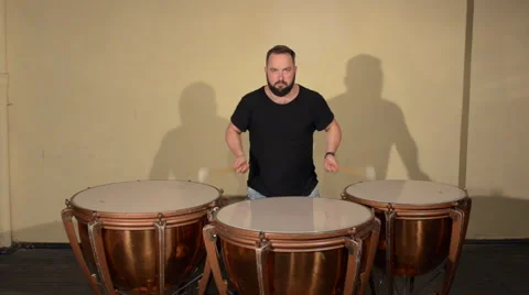 One Man With a Beard in Black T-Shirt, Playing on the Percussion Instrument Stock Footage 67105657