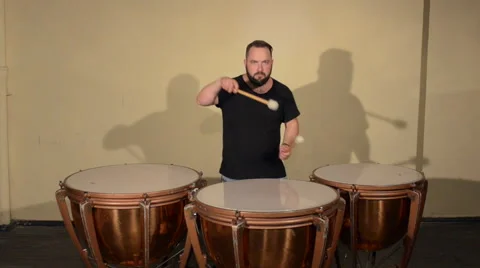 One Man With a Beard in Black T-Shirt, Playing on the Percussion Instrument Stock Footage 67105709