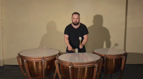 One Man With a Beard in Black T-Shirt, Playing on the Percussion Instrument Stock Footage 67105736