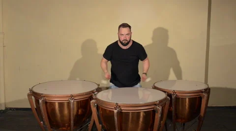 One Man With a Beard in Black T-Shirt, Playing on the Percussion Instrument Stock Footage 67105763