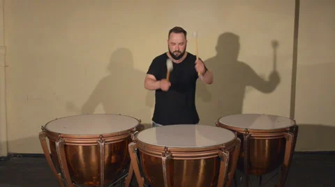 One Man With a Beard in Black T-Shirt, Playing on the Percussion Instrument Stock Footage 67105814