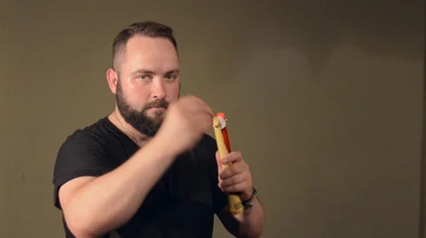 One Man With a Beard in Black T-Shirt, Playing on the Percussion Instrument Stock Footage 67105832