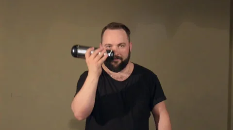 One Man With a Beard in Black T-Shirt, Playing on the Percussion Instrument Stock Footage 67106041
