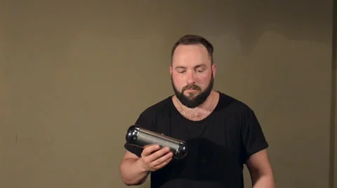 One Man With a Beard in Black T-Shirt, Playing on the Percussion Instrument Stock Footage 67106093
