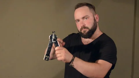 One Man With a Beard in Black T-Shirt, Playing on the Percussion Instrument Stock Footage 67106155