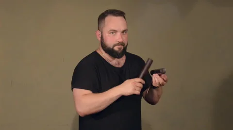 One Man With a Beard in Black T-Shirt, Playing on the Percussion Instrument Stock Footage 67106203