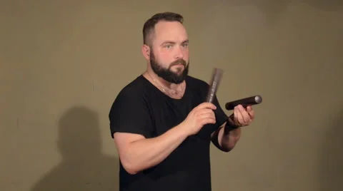 One Man With a Beard in Black T-Shirt, Playing on the Percussion Instrument Stock Footage 67106356