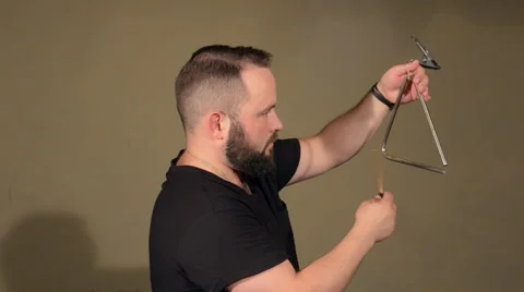 One Man With a Beard in Black T-Shirt, Playing on the Percussion Instrument Stock Footage 67106440