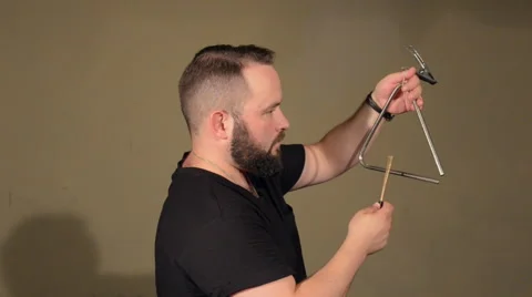 One Man With a Beard in Black T-Shirt, Playing on the Percussion Instrument Stock Footage 67106499
