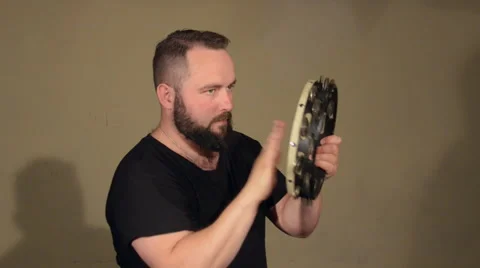 One Man With a Beard in Black T-Shirt, Playing on the Percussion Instrument Stock Footage 67106625