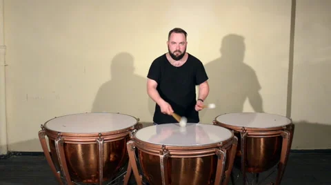One Man With a Beard in Black T-Shirt, Playing on the Percussion Instrument Stock Footage 67186875