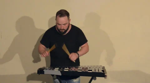 One Man With a Beard in Black T-Shirt, Playing on the Percussion Instrument Stock Footage 68178523