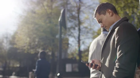 One man in the city using his phone outdoors Stock Footage 97980466