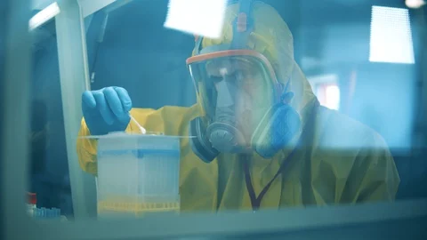 One man develops a vaccine for coronavirus while working in laboratory. Covid-19 스톡 동영상 128838872