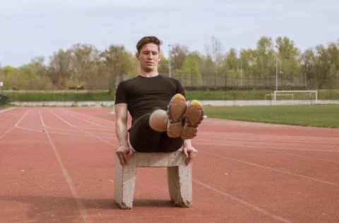 One man exercise abs, concrete block, outdoors fitness tracks Stock Photos