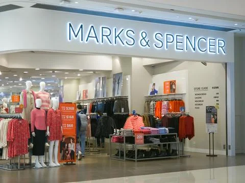 One man go inside the Marks and Spencer Store in Olympian City, Hong Kong. Stock Photos
